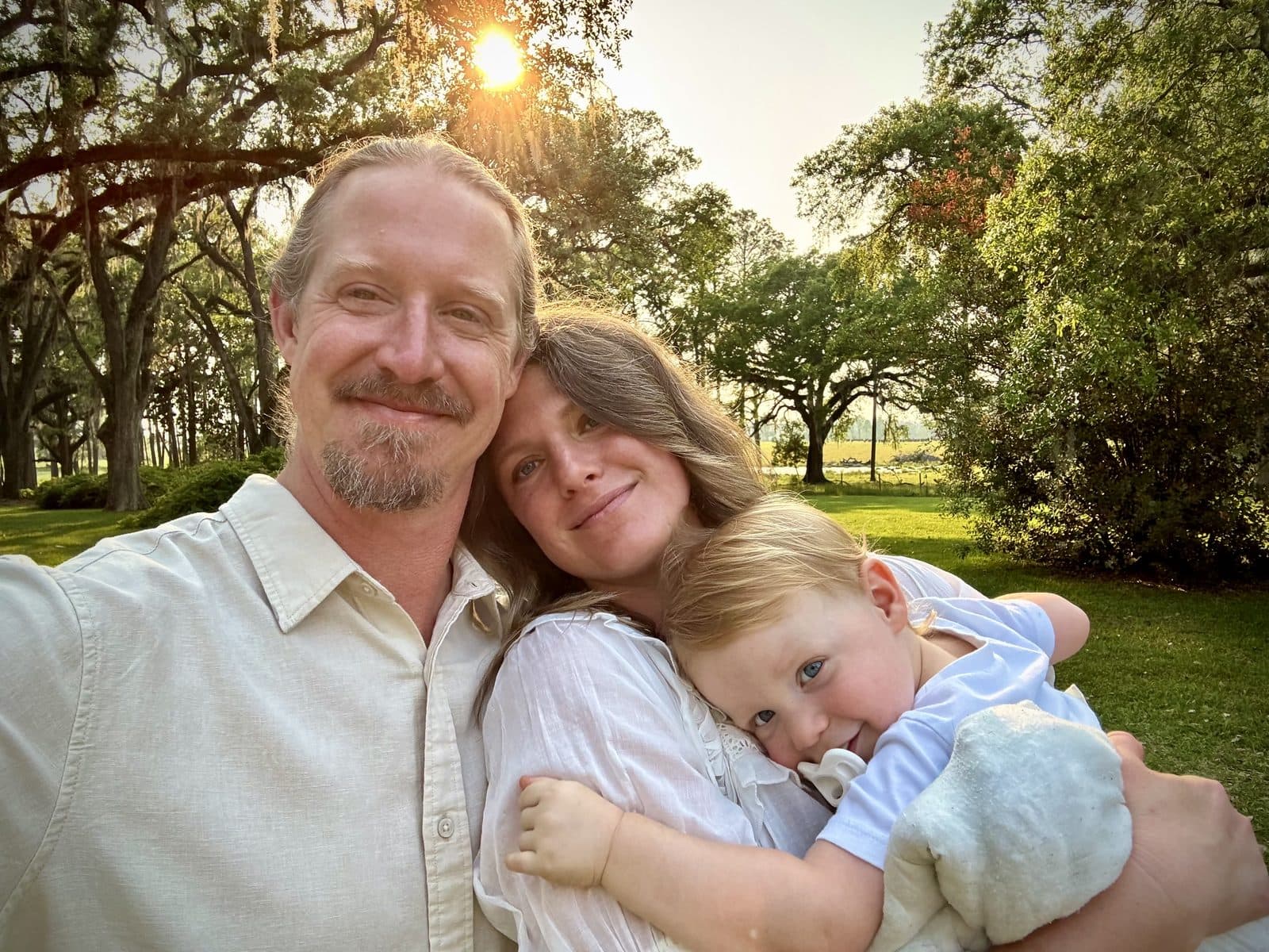Matt and Anna of Blackwater Pastures with their family under the oaks